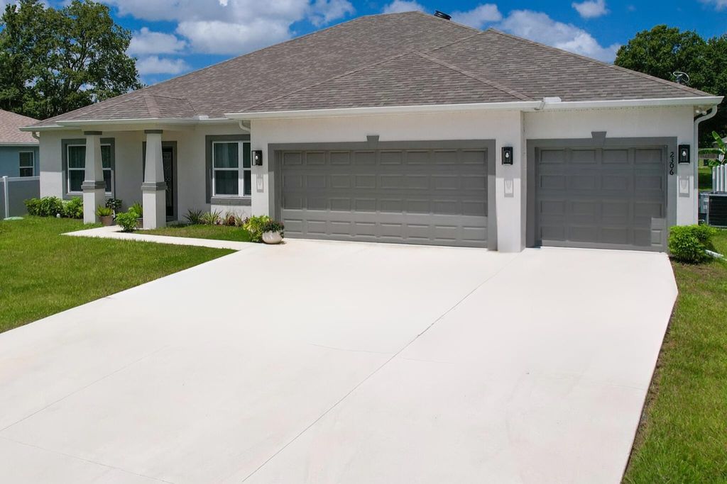 Photo of 2306 SW Pamona Street, Port Saint Lucie, FL 34953 (MLS # R11109367)