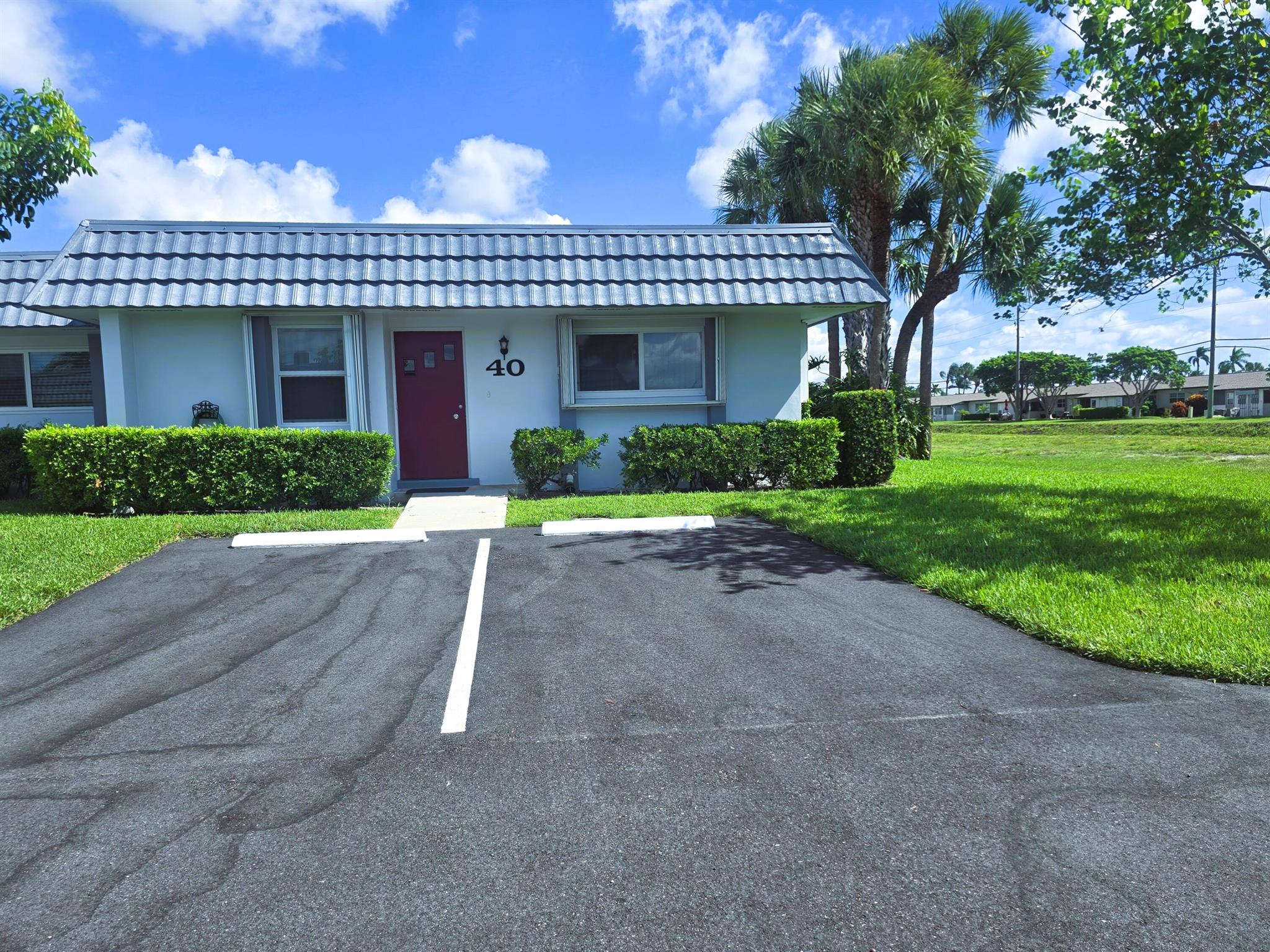 Completely renovated 2-Bed/2-Bath cozy villa in a well-kept 55+ community with new Kitchen and appliances; skip a jump away from your home to the clubhouse, pool, tennis court, shuffleboard and racketball. Enjoy the shady northern exposure of your covered lanai porch. Complete accordion shutters and New Impact Windows provide for peace of mind year round. 18'' tile throughout. An active 55+ community with many social functions and amenities. Spacious dual master suites, and new laundry machines add practicality and peace of mind. Also, cable, water, sewer, and exterior maintenance included. Call today for your private tour!