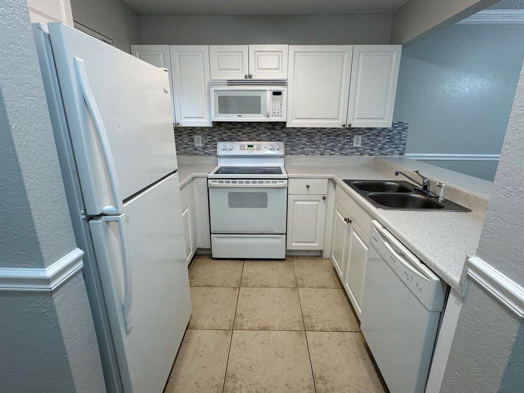 Photo of 1601 Windorah Way #D, West Palm Beach, FL 33411 (MLS # R11128039)