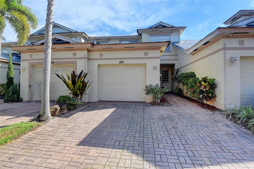 Highly desirable Delray Beach location, this Coconut Key townhouse has 3 BR 2 1/2 BA with natural light throughout, spacious living and dining room, open kitchen, pantry, and laundry room. The backyard has a lovely and peaceful view of the lake. The double-paver driveway leads to the garage and walkway, all the way to the front door. The A/C, water heater, refrigerator, dishwasher, built-in microwave, and quartz countertops are newer. Large walk-in closet in the primary bedroom, blinds/shades on all windows, and extra storage under the stairs. A brand-new roof and gutters are currently being installed, and the exterior will be painted. Assessment will be paid by the seller. Pet-friendly with up to 2 pets. Amenities include a community pool, basketball court, and walking path.