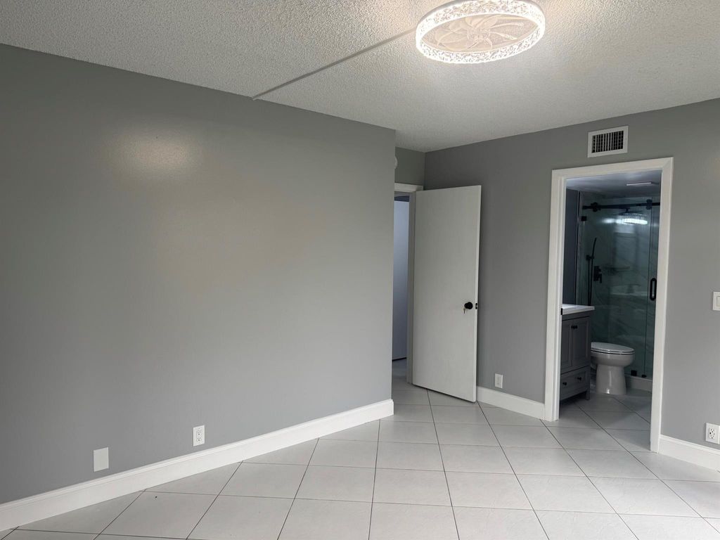 Photo of 802 Sky Pine Way #D1, Greenacres, FL 33415 (MLS # R11147222)