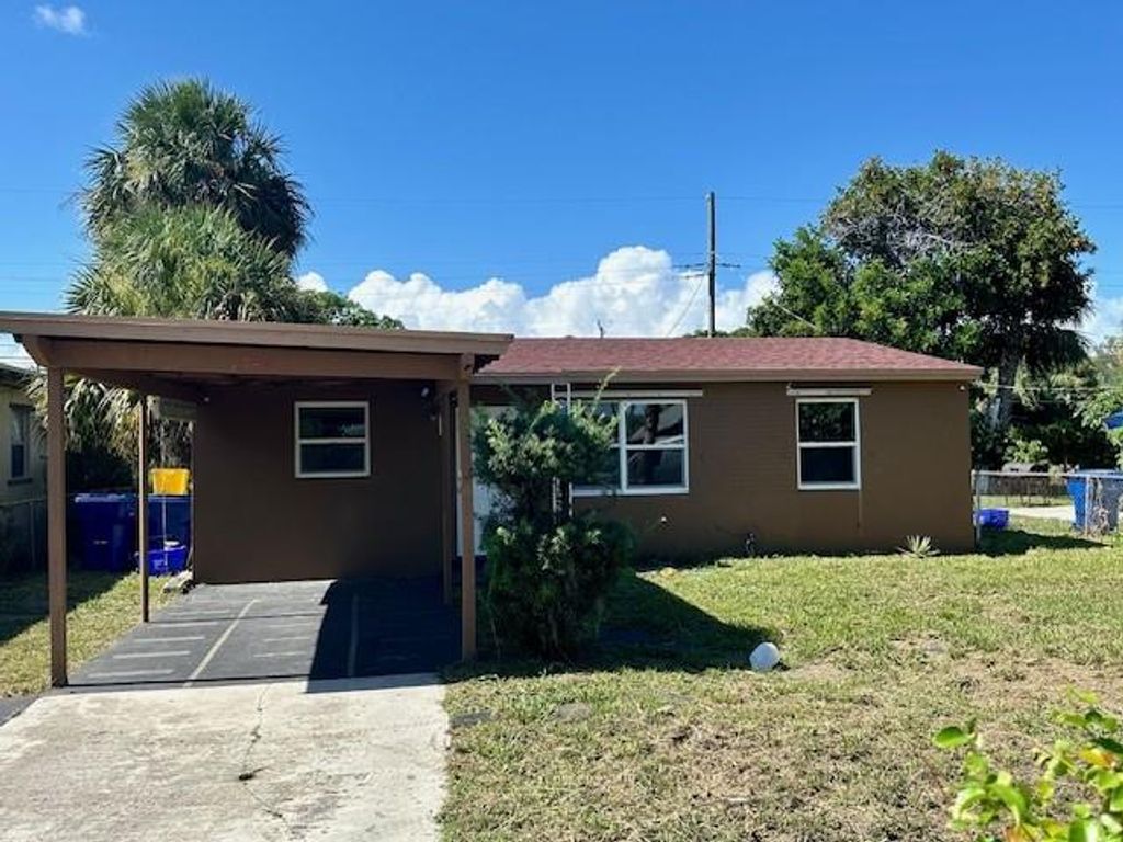 Photo of 1548 W 10th Street, Riviera Beach, FL 33404 (MLS # F10447502)