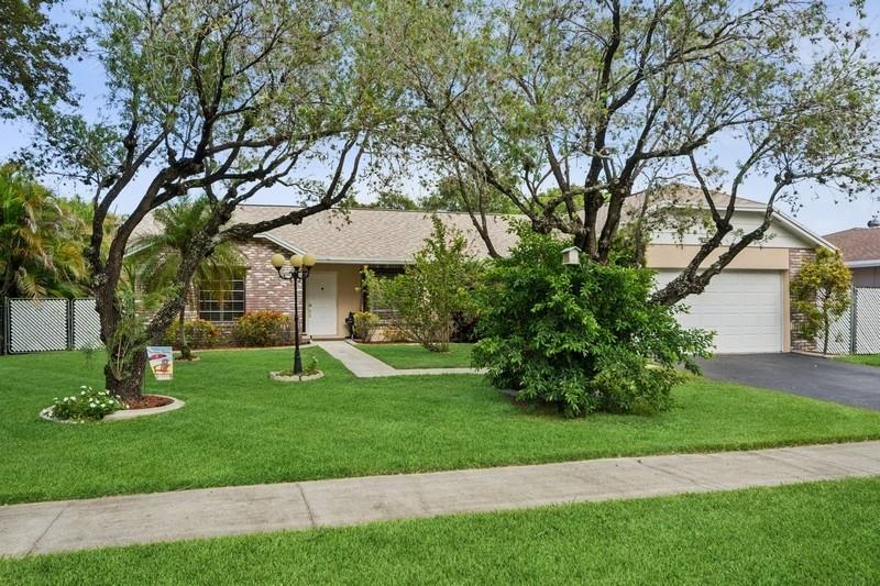 Stunning 3 bed 2 bath home in desirable Orange Tree Lakes in Davie. Plantation shutters adorn all the windows in this spacious well-designed home w/cathedral ceilings in living and dining. Kitchen features newer Samsung appliances and breakfast bar. Primary suite features bath with dual sinks, tub shower, and walk-in closet. The second and third bedroom are good sized with good closet space. Guest bath. Full sized Maytag Washer and Dryer
included. Spacious screened room off dining room leads to large sparkling saltwater pool with pavers and gate to access lake. Lovely awning, outdoor lights and shed complete the spacious back yard. Includes 2-car garage with some shelving and solar water heater. No HOA, You may park your RV and/or boat. Excellent school system. Lake water feeds sprinkler.