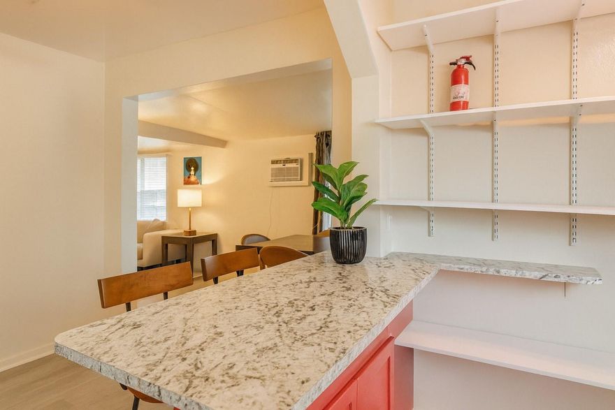 Charming 1920s mission-style property in the heart of East Hollywood, just steps from Young Circle. Beautifully renovated main home featuring wood floors, decorative fireplace, remodeled kitchen, impact windows and doors, open layout, spacious primary suite with en-suite bath, and ample storage. Two separate income-producing units in the rear with private entrances and parking. Live in the front home and rent the back units for immediate cash flow, or lease all three. Fully fenced with tropical landscaping, fruit trees, and inviting terraces that create a private, serene setting. Walking distance to dining, parks, and entertainment. No HOA, no restrictions. Prime investment opportunity.