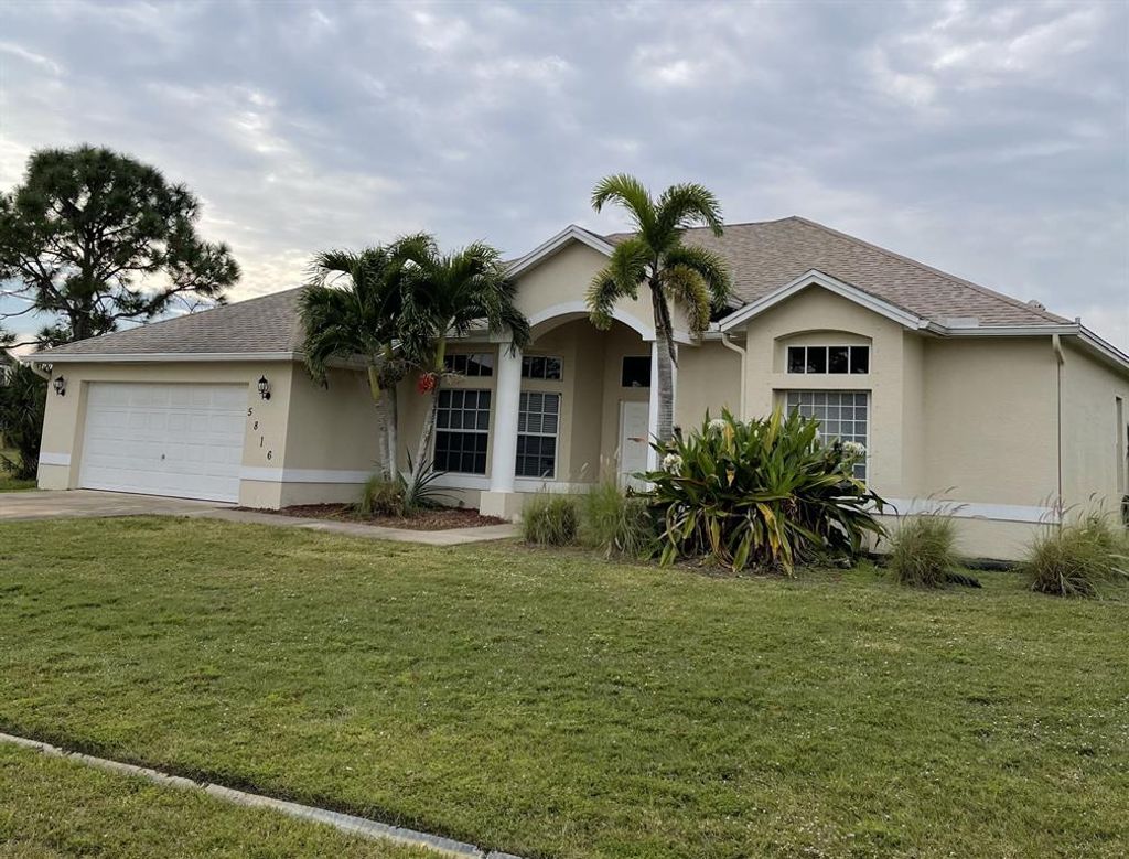 Photo of 5816 NW Coosa Drive, Port Saint Lucie, FL 34986 (MLS # R10683991)