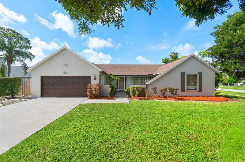 Elevate your lifestyle in Wellington with this exceptional property. Located in a top rated school district, this CBS located on a cul de sac home boasts a quarter acre corner lot. Freshly painted exterior and a functional floor plan with ample living spaces, updated kitchen and vaulted ceilings. The expansive yard is a private paradise complete with an oversize pool, covered patio, wood deck and new artificial turf installed in the back yard. Perfect for unwinding and entertaining. Mature Trees add a sense of sophistication and charm to this incredible property. Other stand-out features include: primary suite w/seating nook & updated private bath. Oversized laundry room. The A/C is 2017 and hot water heater is 2019. Kitchen appliances replaced in 2020