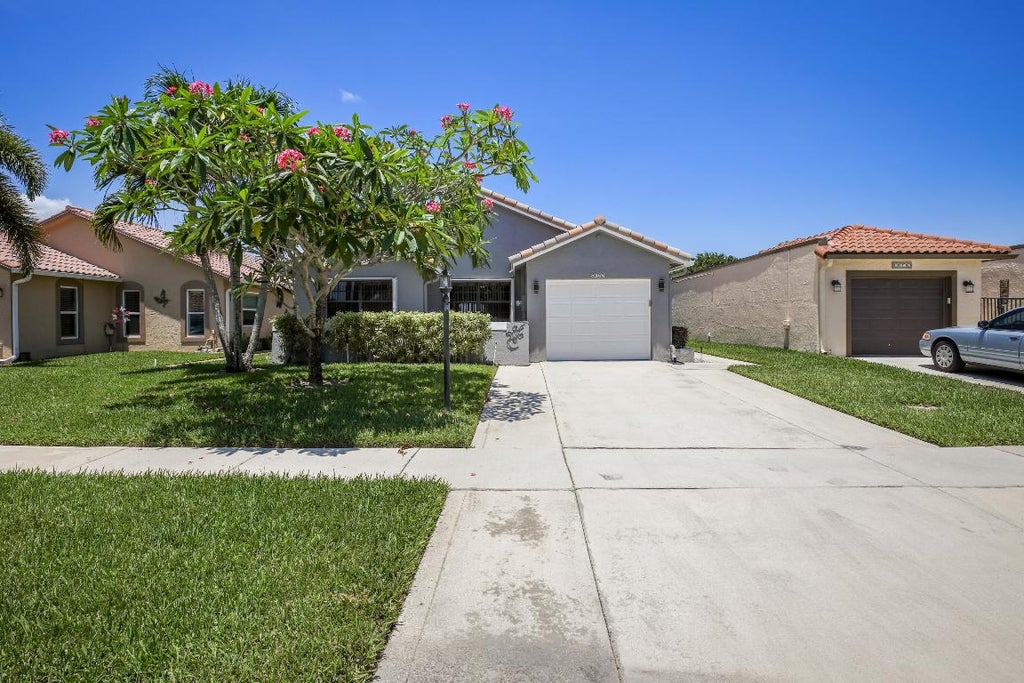 Photo of 8366 Bonita Isle Drive, Lake Worth, FL 33467 (MLS # R10985910)