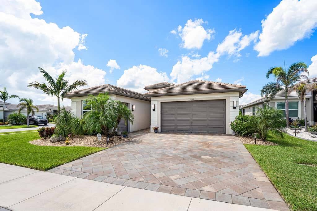 Photo of 12200 SW SANDPIPER Way, Port Saint Lucie, FL 34987 (MLS # B26056102)