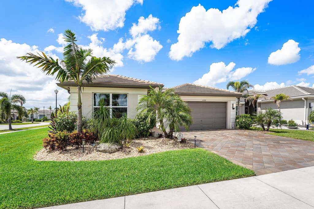 Photo of 12200 SW SANDPIPER Way, Port Saint Lucie, FL 34987 (MLS # B26056102)
