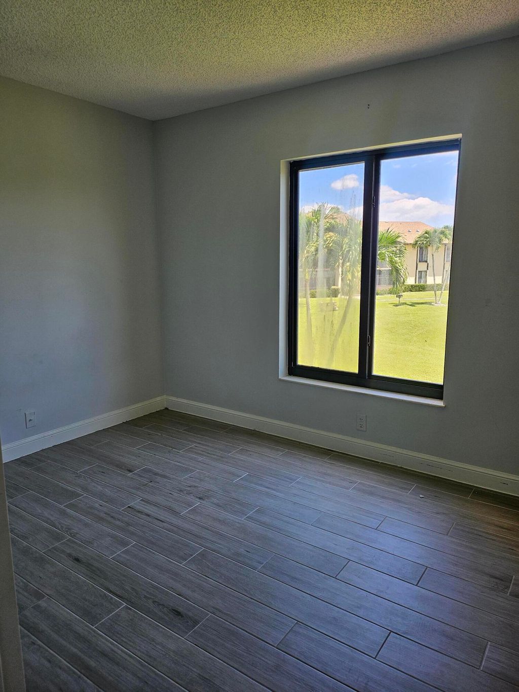 Photo of 811 Sky Pine Way #F2, Greenacres, FL 33415 (MLS # B26023109)