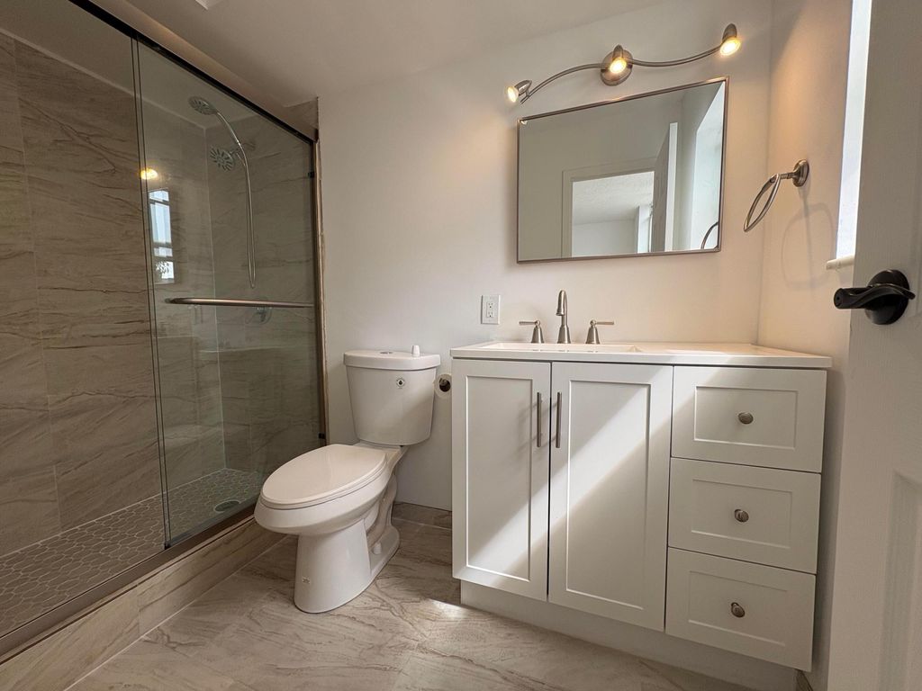 Photo of 2850 Somerset Drive #208l, Lauderdale Lakes, FL 33311 (MLS # B26011990)