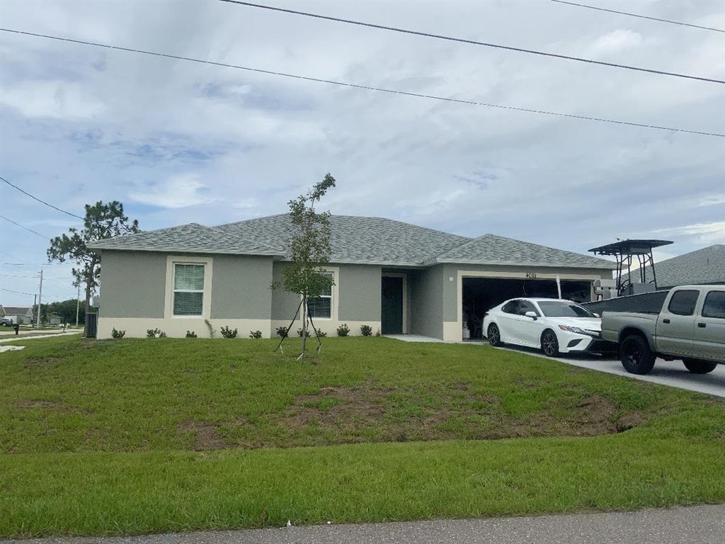Photo of 4001 SW Kadlic Street, Port Saint Lucie, FL 34953 (MLS # R10912696)