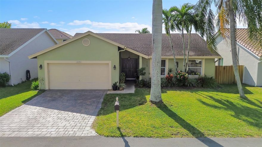 This renovated 3-bed, 2-bath, 2-car garage pool home is located in one of Coral Springs’ most sought-after family neighborhoods. The residence features an open and spacious floor plan with high ceilings, modern finishes, and ample natural light, creating a versatile environment ideal for both entertaining and everyday living.  NEW A/C. The updated kitchen is appointed with white cabinetry, quartz countertops, and premium SS appliances. A private primary suite offers a remodeled bathroom and walk-in closet, additional bedrooms share an updated bathroom. Living areas connect to a screened patio, pool, and fully fenced, tropically landscaped outdoor area. Further enhancements include a paver driveway and lush landscaping. Near top-rated schools, parks, dining, and shopping options.