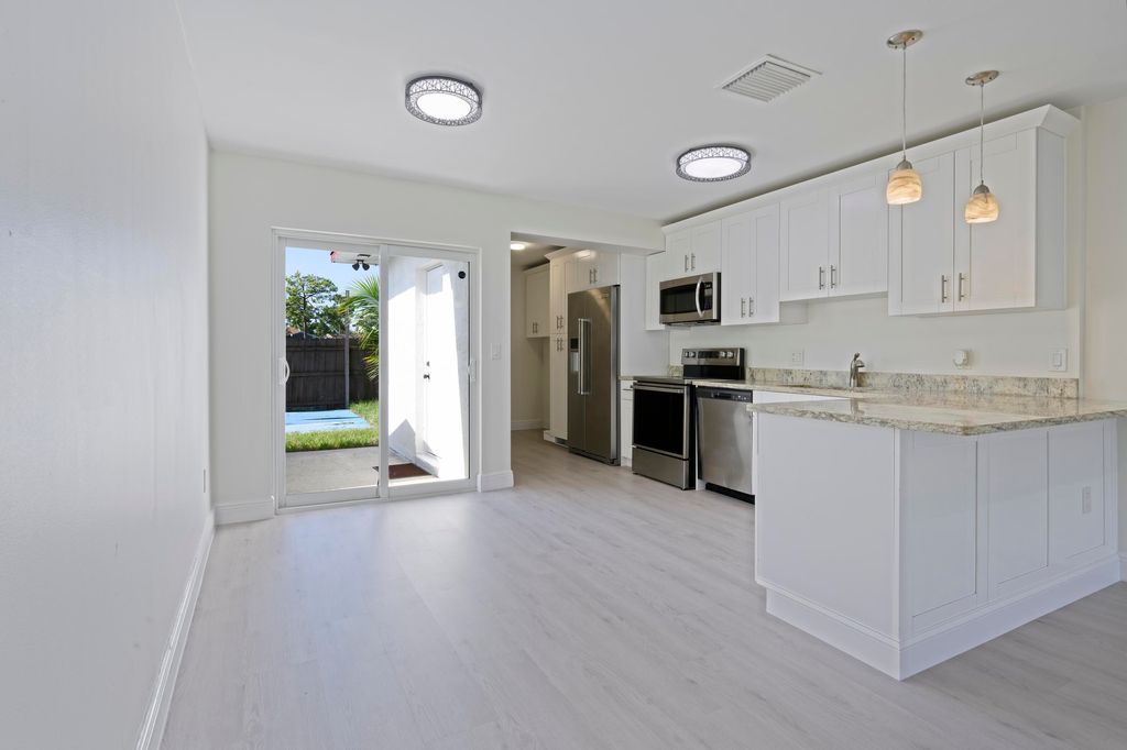 Photo of 5042 Grant Lane, West Palm Beach, FL 33415 (MLS # R11124985)