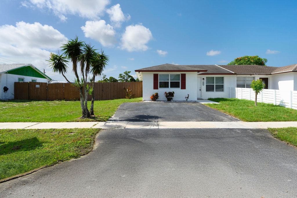 Photo of 5042 Grant Lane, West Palm Beach, FL 33415 (MLS # R11124985)