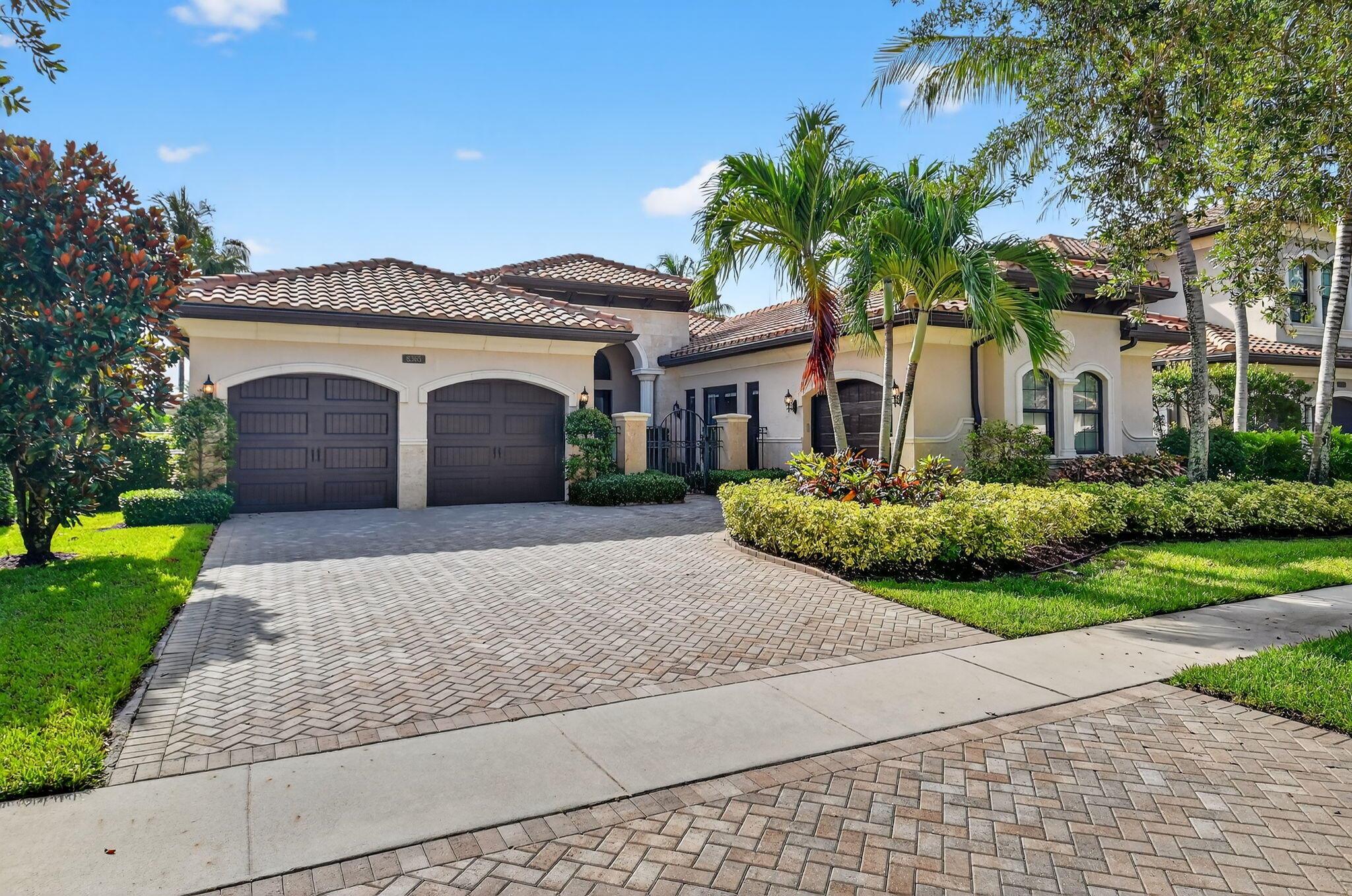 Step into refined luxury in this fully furnished, custom-furnished, designer-upgraded residence located in the prestigious community of The Bridges. Offering 3 bedrooms, 3.5 bathrooms, and a custom clubroom/office, this exceptional home seamlessly blends sophisticated style with modern convenience. A private courtyard entry with etched glass double doors leads to a welcoming foyer, setting the tone for the elegance found throughout. Step into a grand living area featuring gleaming marble floors, impact windows and doors, soaring coffered ceilings, surround sound, and crown molding throughout. The living room is enhanced by a custom wet bar and striking white stone columns, while newly installed oversized sliding glass doors with transom glass panels bathe the space in natural light.