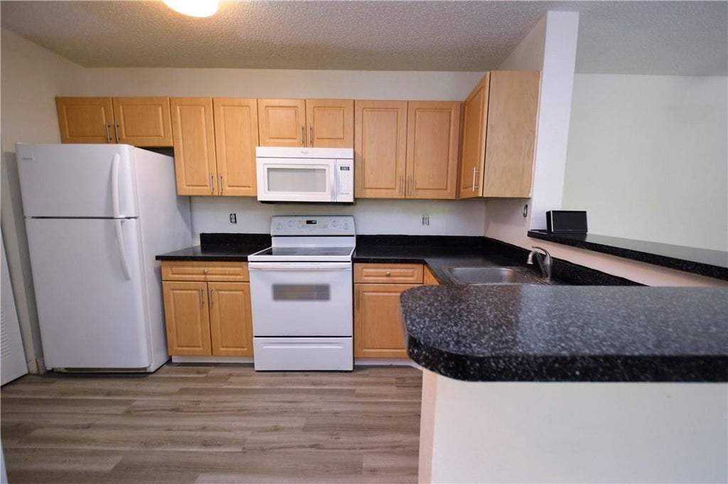 Photo of 11229 W ATLANTIC Boulevard #306, Coral Springs, FL 33071 (MLS # B26081907)