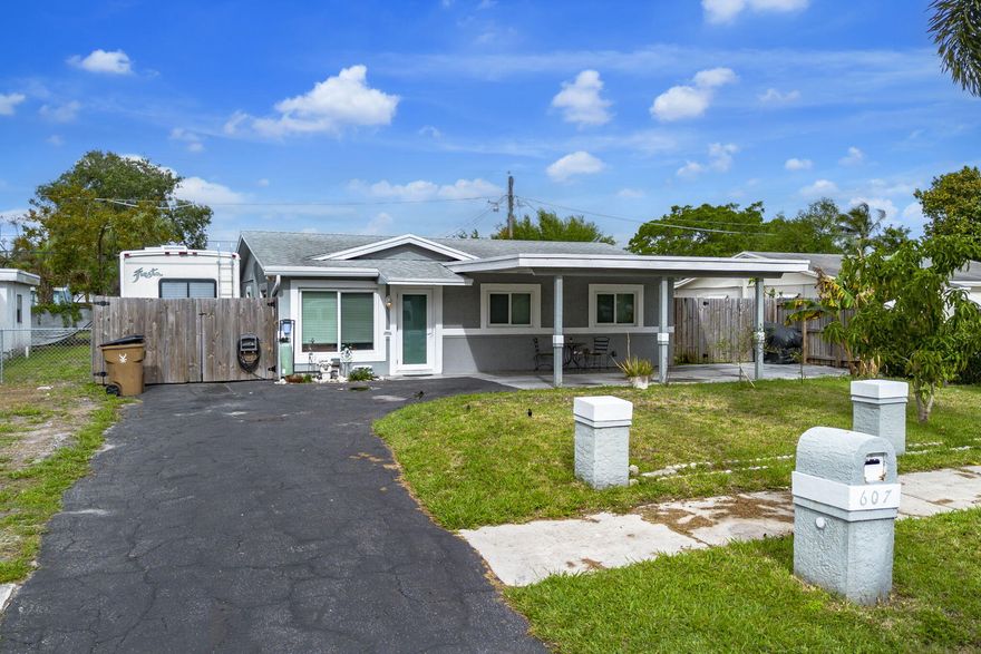 Perfectly maintained 3 bed, 1.5 bath home in Deerfield Beach with major upgrades and outdoor space built for Florida living. Features include a new roof (2021), impact windows and doors (2022), newer washer and dryer (2023), added kitchen appliances (2017) and a 1-inch copper water main with whole-house filtration (2023). Gas tankless water heater with 120-gal propane tank and generator hookup add efficiency and peace of mind. Fully fenced yard offers boat/RV storage behind a gated driveway, plus electric hookup. Enjoy a backyard shed, fire pit, and plenty of room to entertain. Mizner Marina is just down the street for easy boat launch. Conveniently located near I-95, Downtown Boca Raton, and the beaches. Great value with solid systems and no HOA!