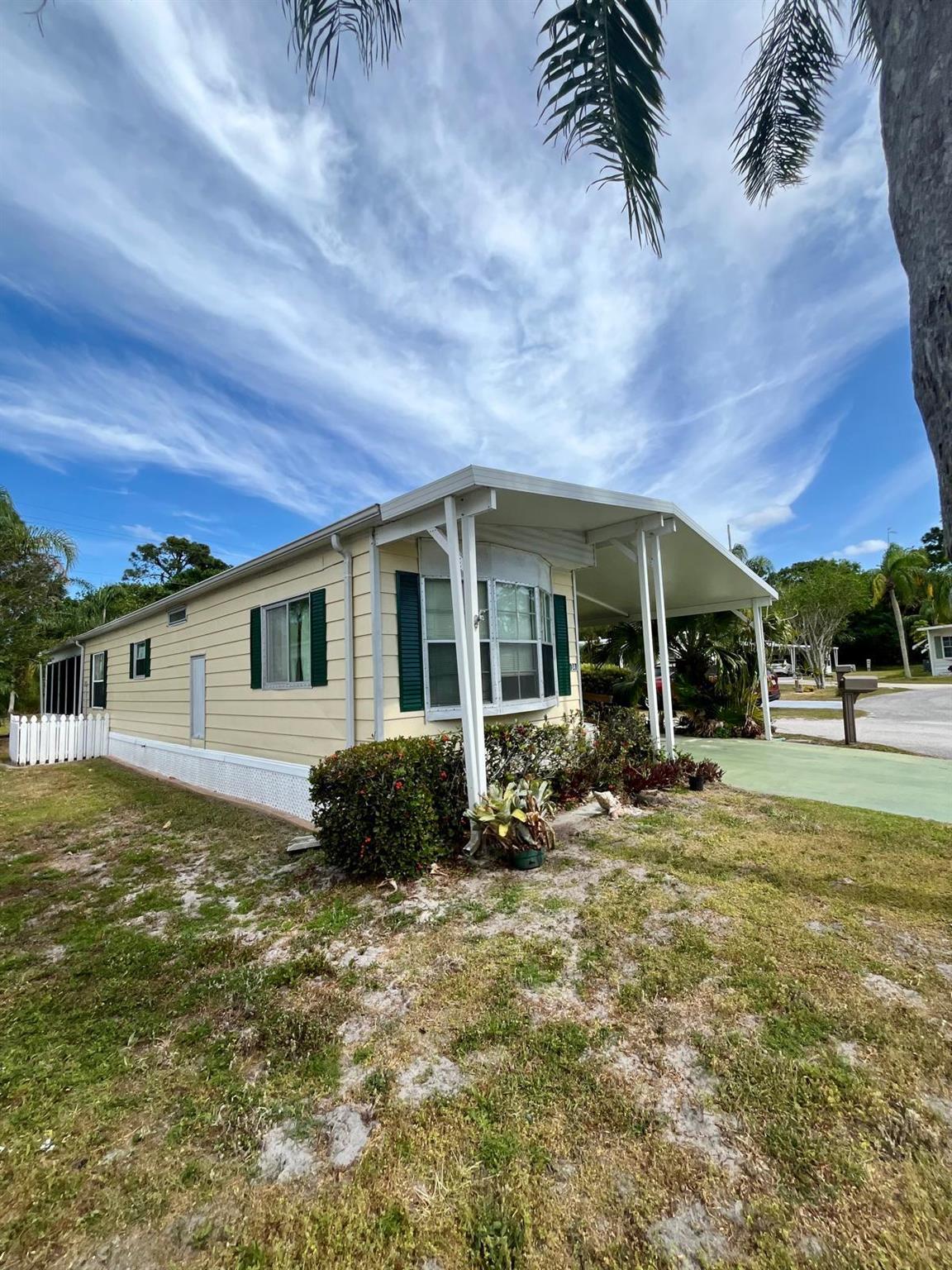 Welcome to this beautiful home move-in ready, in pet section, with two spacious bedrooms with ample closet space, with a big and comfortable living area perfect for relaxing, fully equipped kitchen for cooking and entertaining and an enclosed Florida room space ideal for enjoying the Florida sunshine.With its proximity to beaches, stores, and restaurants, this mobile home offers the perfect blend of relaxation, convenience, and lifestyle. Enjoy the best of Florida living in this beautiful 55+ community!- Clubhouse with social events and activities- free golf- Swimming pool and outdoor recreation areas- Walking trails and outdoor spaces for relaxation- tennis, billiards, fitness and more.The land rent includes trash removal and land care,