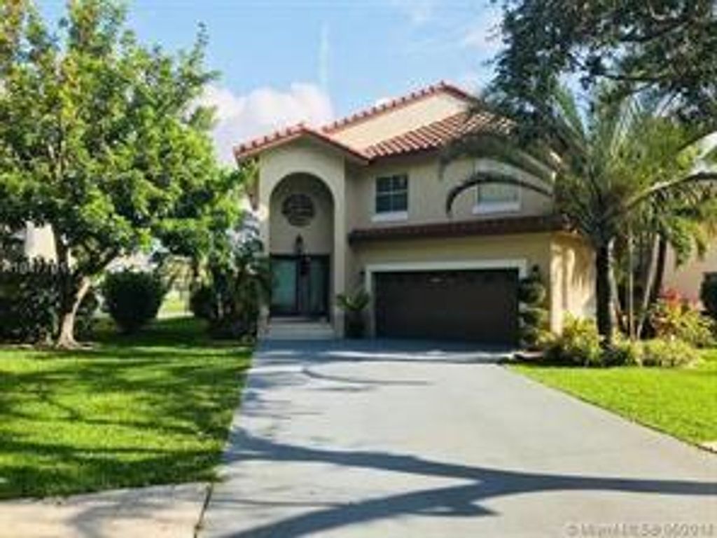Photo of 5841 NW 60th St, Parkland, FL 33067 (MLS # F10317362)