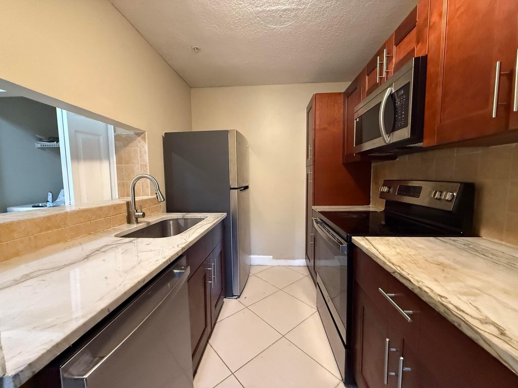 Photo of 2317 N Congress 14 Avenue #14, Boynton Beach, FL 33426 (MLS # R11062671)