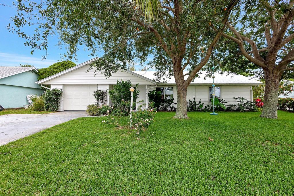 Photo of 1718 NE 21st Terrace, Jensen Beach, FL 34957 (MLS # R10988634)