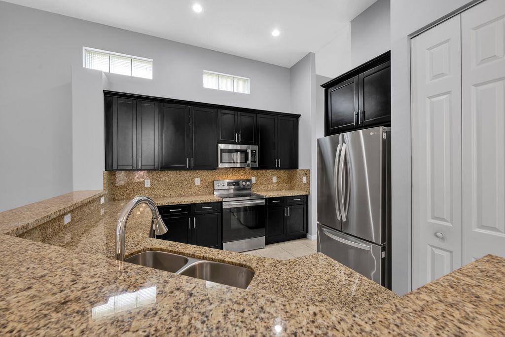 Photo of 9357 Osprey Isles Boulevard, West Palm Beach, FL 33412 (MLS # B26030207)