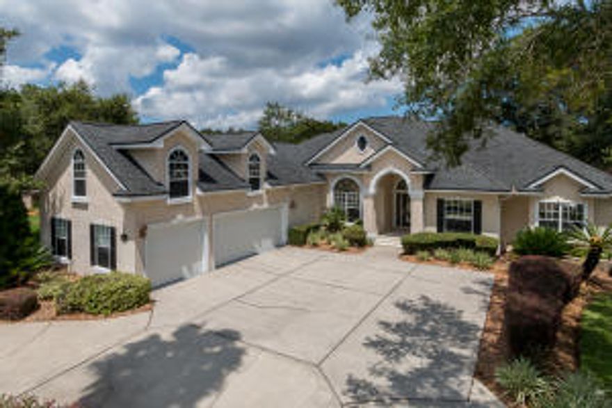 Jax Golf and Country Club - Highly desired water-to-golf views, only one of very few in this exclusive neighborhood. 5 bedroom 4 bath, completely updated home! Come see what this seller has done to make this your dream home! This home is very bright with natural light and many windows overlooking the lake, golf course, and private fenced-in backyard. Features include granite throughout, new stainless appliances, gas cooktop, fresh paint, wood and carpeted floors, new tile flooring in bathrooms, window treatments including plantation shutters, gas fireplace with stone finish, inside laundry room with sink. The 2nd floor in-law or guest suite has its own private bath and separate heating & cooling. The home is extremely energy efficient with new stainless energy efficient appliances,