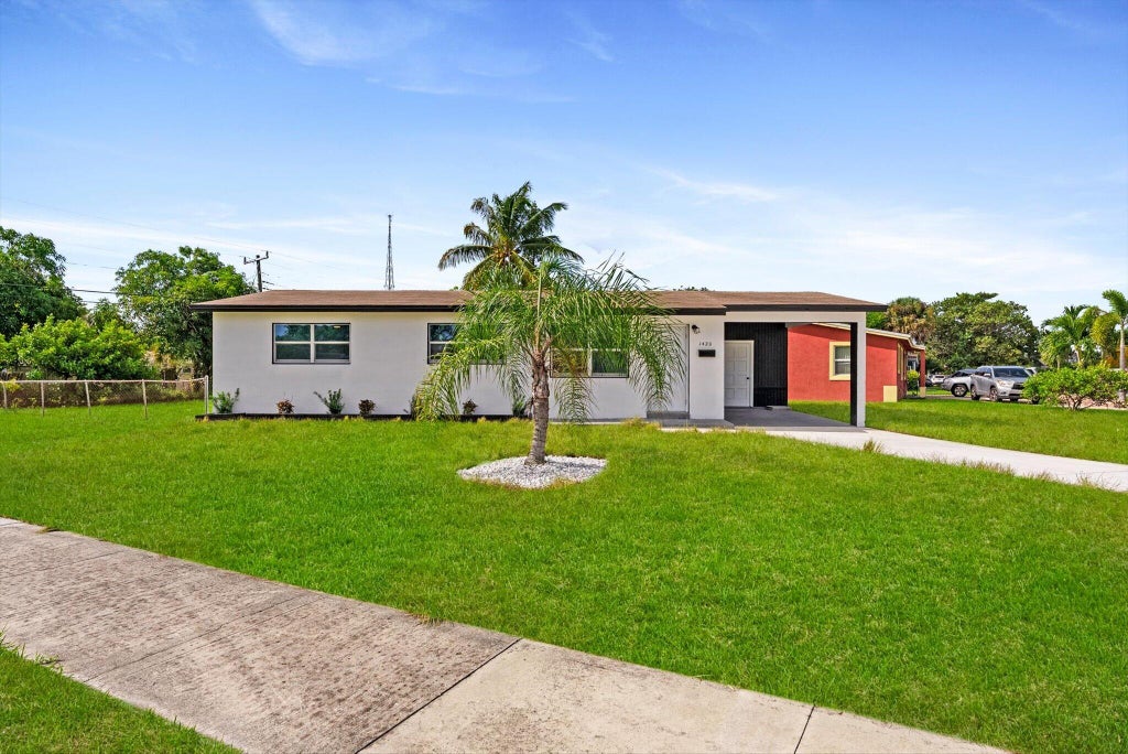 Photo of 1420 9th Street, Lake Park, FL 33403 (MLS # B26089576)