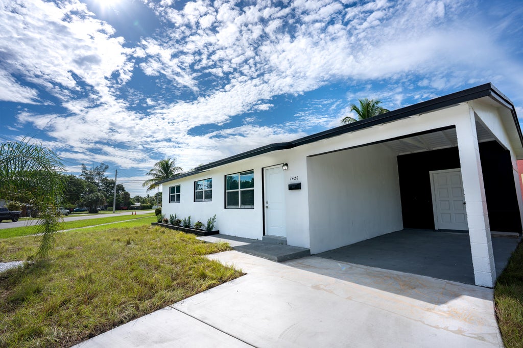 Photo of 1420 9th Street, Lake Park, FL 33403 (MLS # B26089576)