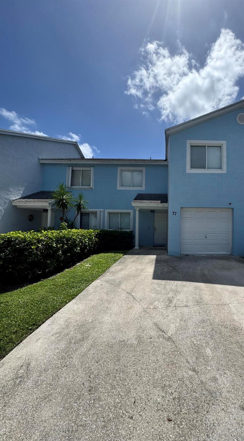 ROYAL PALM BEACH GEM!!COMPLETELY REMODELED. NEW BATHRROMS, FLOORS, FRESHLY PAINTED. READY TO MOVE IN. INCLUDES ALL APPLIANCES & WASHER & DRYER. 4 LARGE BEDROOMS, LOFT, 3 FULL BATHROOMS, ONE BEDROOM & BATHROOM ON FIRST FLOOR. WALK-IN-CLOSETS IN EACH ROOM. LARGE PATIO OVERLOOKING GREEN AREA. ONE CAR GARGAGE WITH OVERSIZE DRIVEWAY, FITS UP TO 3-4 CARS. COMMUNITY POOL. CLOSE TO ALL YOUR SHOPPING AND DINING NEEDS. JUST MINS TO MAJOR HOSIPTAL, MALLS & ALL YOUR DESIRES. A MUST SEE TO APPRECIATE.