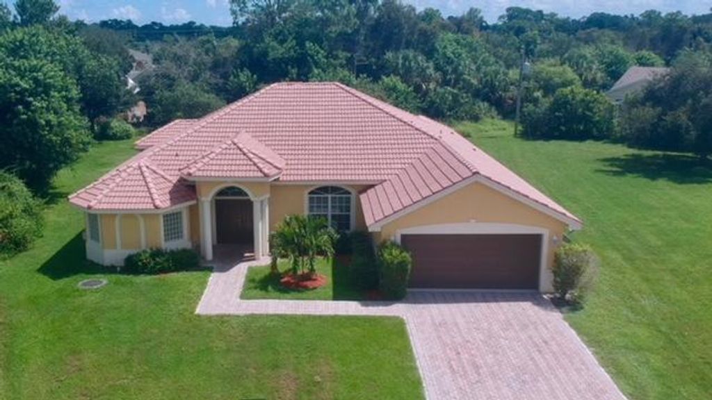 Photo of 1202 SW Parma Avenue, Port Saint Lucie, FL 34953 (MLS # R10952993)