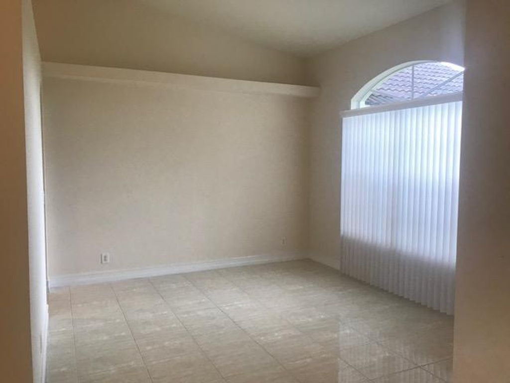Photo of 1202 SW Parma Avenue, Port Saint Lucie, FL 34953 (MLS # R10952993)