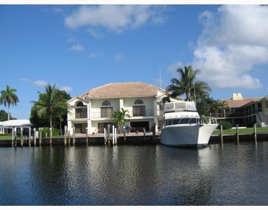 Deep water-no fixed bridges- boat 50ft dockage and spectacular views of Seminole Bay from this townhome in A-rated Bayview School district.Beautiful high-end  kitchen with maple cabinets,granite tops,sub-zero frig,cooking island and work station-all overlooking the water!Upstairs master bed/bath with walk in closet. Bathroom redone with 2 sinks, soaking tub,vanity with granite tops, etc. Downstairs office or den.1 car garage.No fee for dockage.Close to Galleria Mall, George English Park( tennis)and beach!