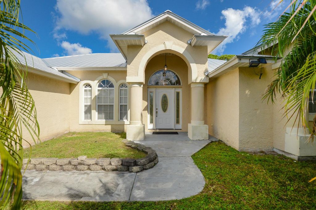 Photo of 731 SE Browning Avenue, Port Saint Lucie, FL 34983 (MLS # R11134924)