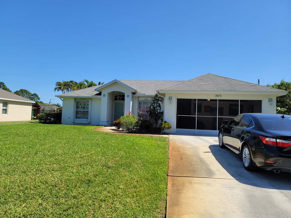Photo of 1973 SW Castinet Lane, Port Saint Lucie, FL 34953 (MLS # R10788708)