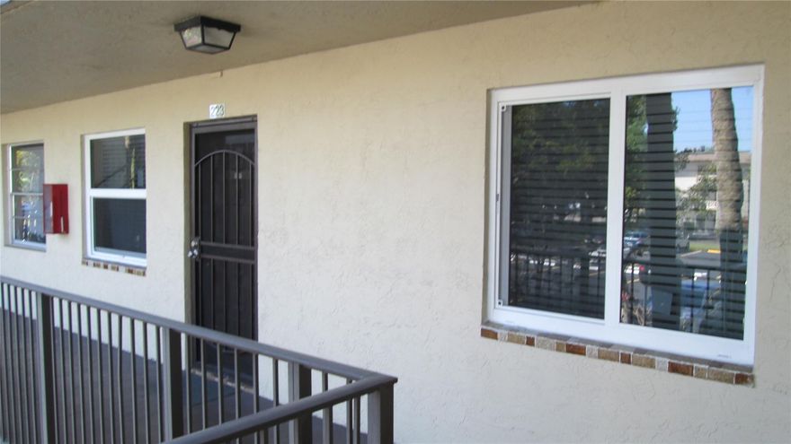 Reduced 35k. Beautiful 2bedroom/2bath condo in Cypress Chase North. All ages. A gated community with breathtaking lake views from the enclosed patio for extra living space. The owner spent over 20k installing new hurricane windows  throughout the unit and on the enclosed patio. The home features: new range, microwave, dishwasher, washer/dryer, crown molding, and water heater. Both baths redone. The 1st bedroom has laminate flooring and the kitchen has new tile floors. This is a "Must See " unit. The community has an Olympic-size pool. clubhouse, gym, sauna, tennis, and basketball courts. Completed 40-year inspections. The HOA includes cable, internet, water and sewer. Washer and dryer inside the unit on the patio.