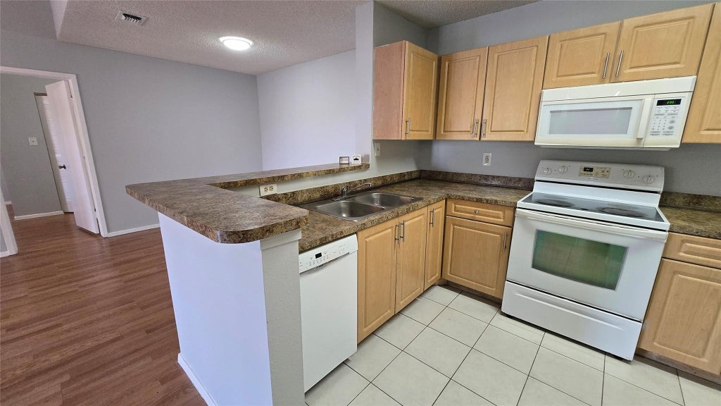 Photo of 11205 W Atlantic Boulevard #305, Coral Springs, FL 33071 (MLS # F10554393)