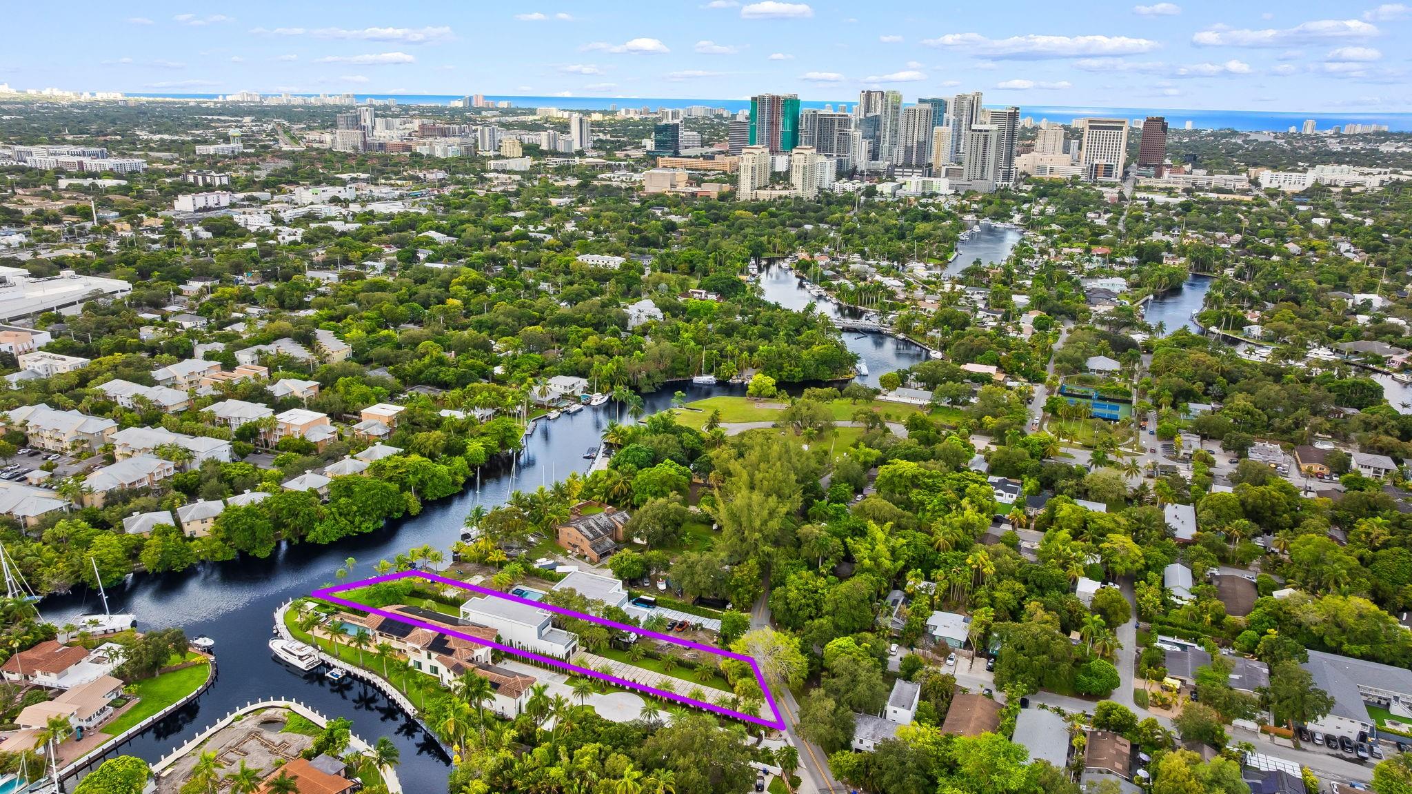 Nestled in the enclave of Riverside Park and sitting on over 1/2 an acre of land, 1407 SW 5th Ct is a newly built waterfront masterpiece blending sophistication and comfort. Completed in 2023, this 5-bed, 4-bath gated home spans nearly 3,700 sq. ft. with soaring ceilings, expansive living areas, and refined finishes throughout. The chef’s kitchen features premium appliances and sleek design, flowing seamlessly into light-filled gathering spaces. Outdoors, a private pool, lush landscaping, and a spacious dock with no fixed bridge access create the ultimate South Florida lifestyle. A 4-car garage, high-impact doors, and generous lot further elevate its appeal. Minutes from downtown Las Olas, dining, and the beach, this residence offers a rare balance of luxury, privacy, and convenience.