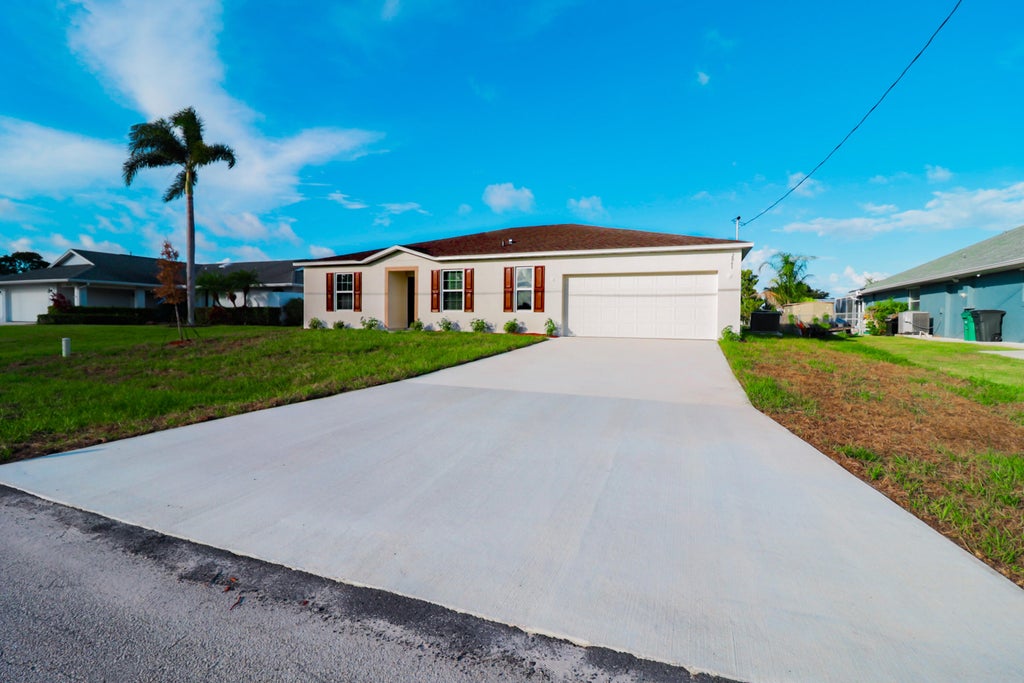 Photo of 2061 SE Mantua Street, Port Saint Lucie, FL 34952 (MLS # B26040937)