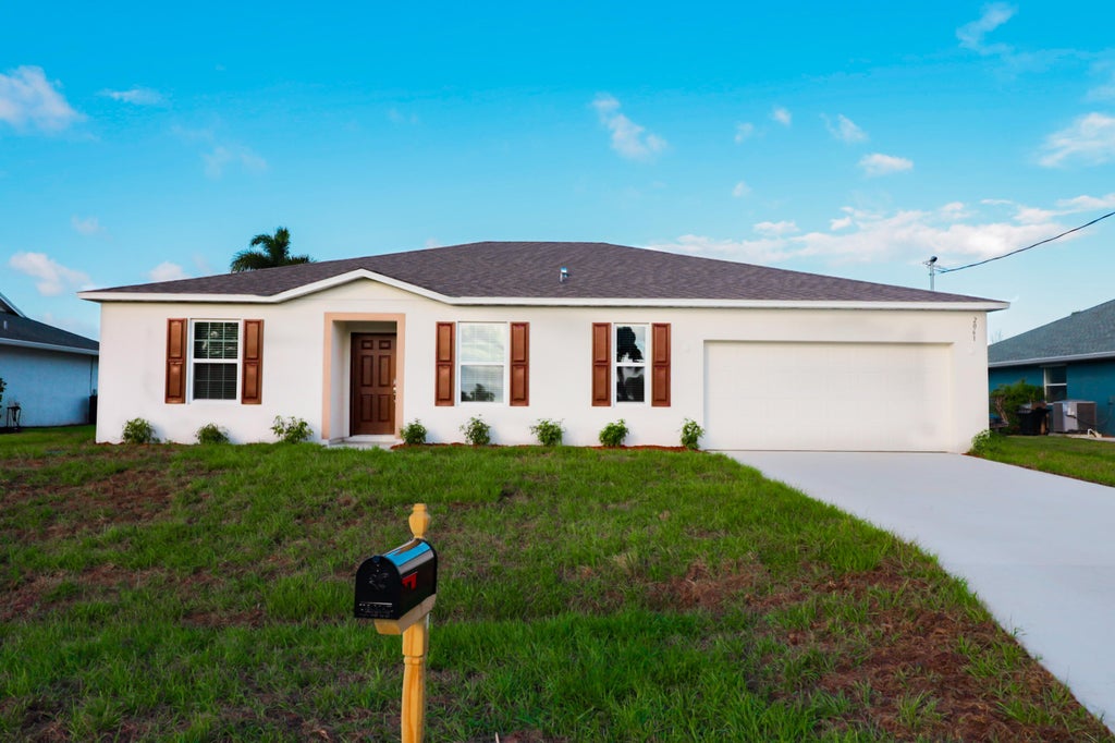 Photo of 2061 SE Mantua Street, Port Saint Lucie, FL 34952 (MLS # B26040937)