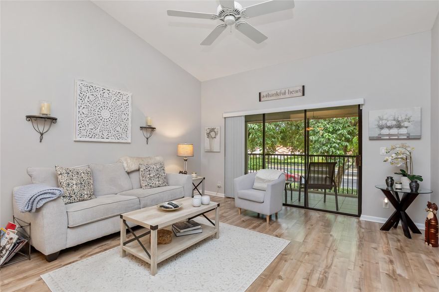 Welcome to Independence Bay, a resort-style, guard-gated community in Deerfield Beach offering a clubhouse, multiple pools, tennis, pickleball, basketball, fitness center, marina & scenic lakes with walking paths perfect for boating, kayaking, or relaxing strolls! This 2nd-floor condo with no upstairs neighbors features vaulted ceilings in the living area and primary bedroom, giving the home an open and airy feel. Additional highlights include laminate flooring throughout, updated bathrooms, accordion hurricane shutters and a large screened balcony. The association covers all amenities, guard gate, common areas, insurance, roof repairs/replacement, and cable (coming soon). Excellent location near I-95, Sawgrass Expressway, and just a short drive to the beach! Don't miss this opportunity!