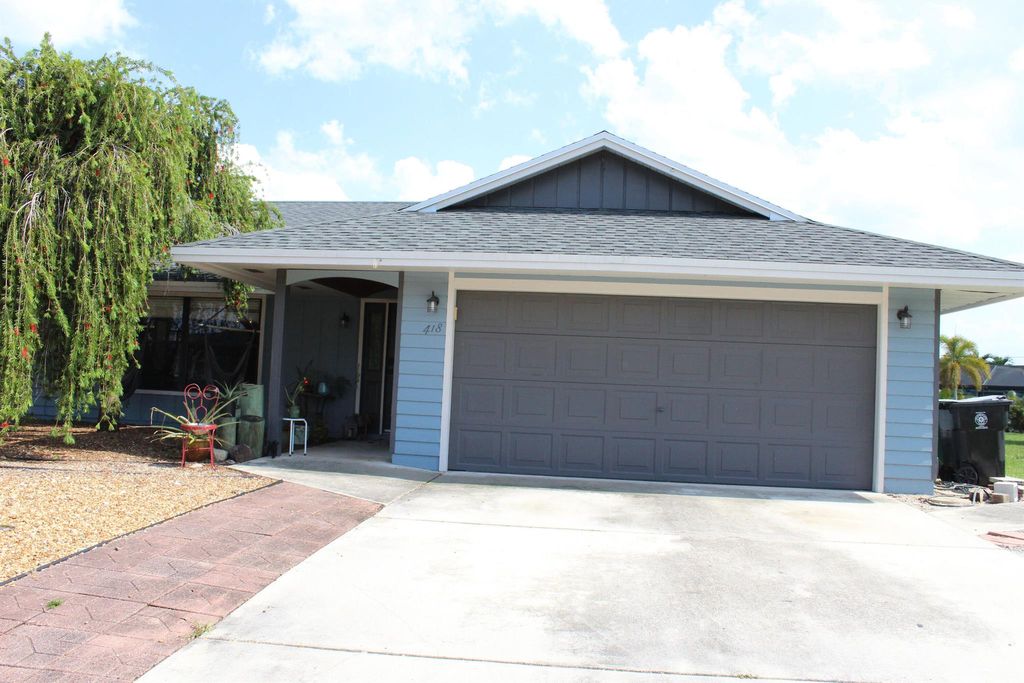 Photo of 418 SE Langfield Avenue, Port Saint Lucie, FL 34984 (MLS # R10990367)