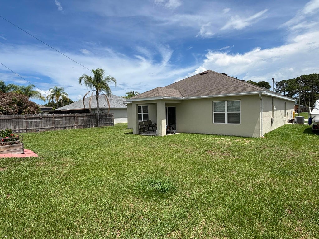 Photo of 1169 SW Hunnicut Avenue, Port Saint Lucie, FL 34953 (MLS # B26056515)