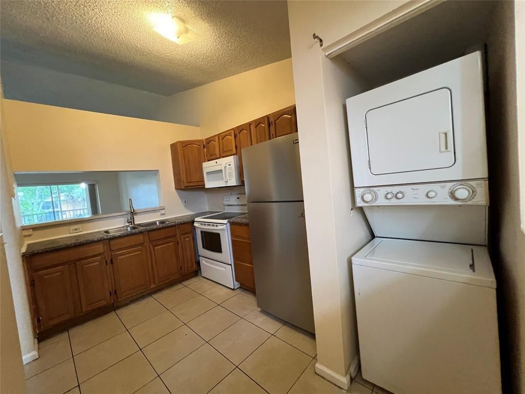 Photo of 2431 NW 56th Avenue #5-201, Lauderhill, FL 33313 (MLS # B26024201)