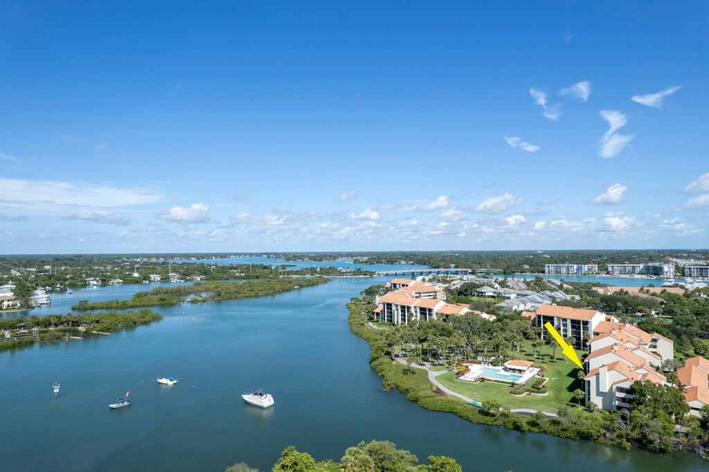 Enjoy breathtaking waterfront views from this fully remodeled, never-lived-in condo in the heart of Jupiter. Featuring impact doors and windows, plus a brand-new roof (2024), the building has passed its Surfside structural integrity exam. The assessment is fully paid, and the community has strong reserves. Located in a gated enclave with 24-hour security, enjoy a resort-style pool, tennis and pickleball courts, kayak/paddleboard launch, walking paths, and marina with boat slips--no fixed bridges and minutes to the Inlet. Walk to 1000 North, Utiki, Jetty's, Lucky Shuck, Harbourside, and a paddler-friendly island across the water. Jupiter Beach is just a short bike ride away.