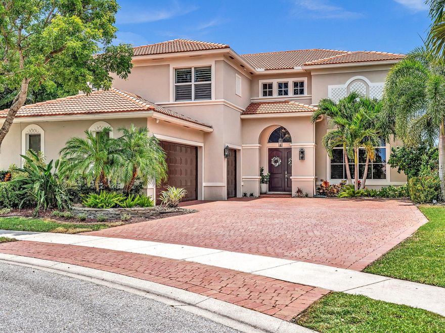 This is the home you have been waiting for! Chic, designer decorated 4 bedroom plus den masterpiece with heated salt water pool on private, lakefront lot. No detail has been spared in this remodeled move in ready home.  The modern kitchen sparkles and delights with center island, porcelain countertops, and updated appliances overlooking a cozy breakfast nook and walk in pantry. Marble flooring and a wrought iron spiral staircase highlight the grand entry into this estate home featuring over 3,500 square feet of living space. Custom wall moldings and a coffered ceiling grace the formal dining room while the living room boasts volume ceilings and elegant window treatments. A downstairs bedroom with remodeled cabana bath makes for a perfect guest room, playroom, office, or library. Relax and unwind on the screened in terrace overlooking the lake from the primary suite - a perfect place to enjoy sunsets! Beautifully reimagined, the renovated bath features a glass encased steam shower, soaking tub, and contemporary dual vanities. A wood beam ceiling, decorative candlelight fireplace and expanded His and Her walk in closets complete this truly special suite. Throughout the home you will find luxurious details including oak wood flooring, plantation shutters, and crown molding. For your convenience there are 2 newer zones of air conditioning (2017), new water heater (2023), impact glass and shutters, and an oversized 3 car garage. Cobblestone Creek is a manned gated community featuring a clubhouse, resort style community pool, and fitness center. Steps away from the shops and restaurants at Cobblestone Commons and Canyon Town Center. Top school district, all ages, and pet friendly. A must see!