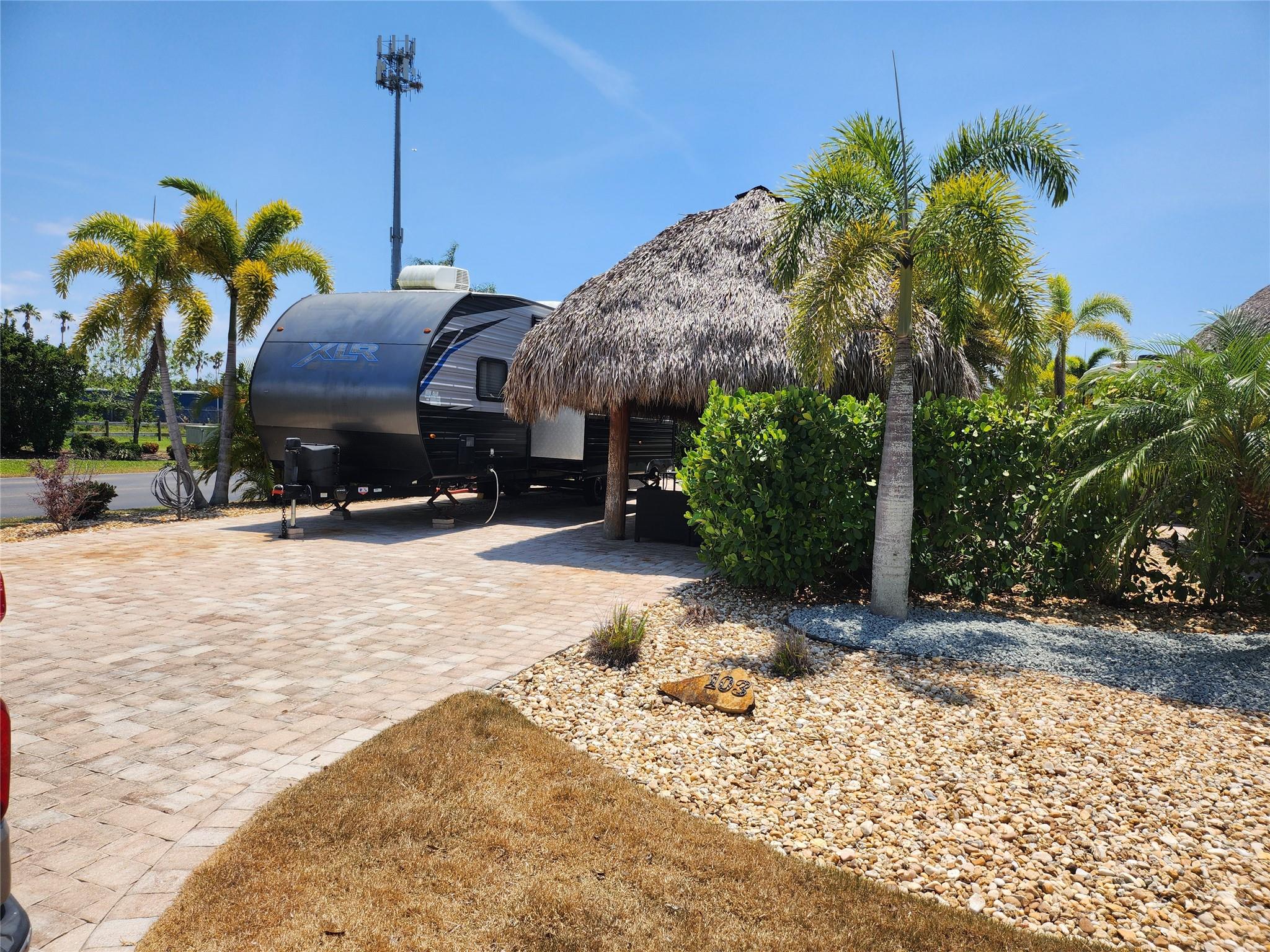 SILVER PALMS 5 STAR RV RESORT LOT 103: Outstanding opportunity.. corner lot across from pasture view. Newly rethatched Authentic Seminole Tiki w elect, admirable outdoor kitchen. Near club house with library, billiard room/card, gym, , pool, spa, pool bar, shuffle board, pickle ball courts, active calendar, private owner's guest facility, dog park, paved roads, downtown near by, shopping, dining. Minutes to the great Lake Okeechobee & public pier, boat rentals, fishing, hiking, bicycling.
Possible golf cart & RV
Buyers to verify conditions and sizes