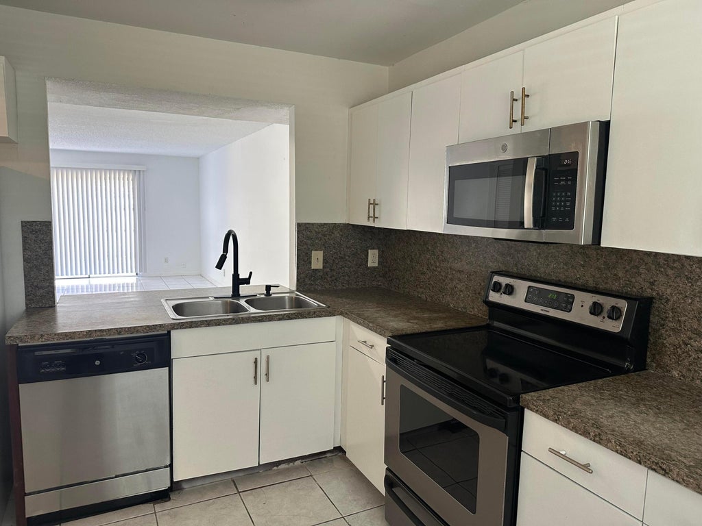 Photo of 931 SW 20TH Court, Delray Beach, FL 33445 (MLS # B26062960)