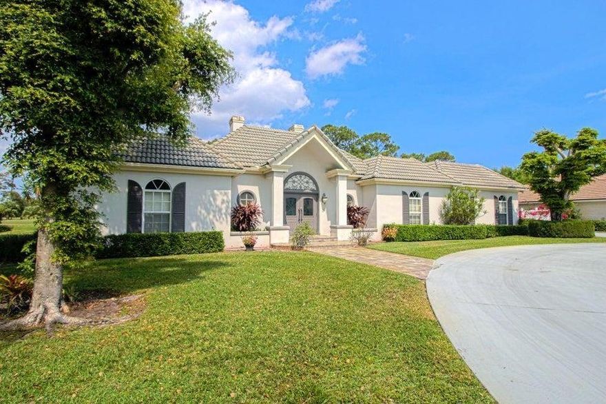 Palm Beach style residence with classic elegance situated on nearly a 1/2 acre golf course lot is a stunner! Gorgeous Travertine flooring greets you at the front door and winds throughout all living areas. This home features 3 bedrooms, 3.5 bathrooms, an open floor plan updated kitchen with adjoining family room complete with coquina fireplace, a separate formal dining room situated adjacent to the formal living room that overlooks the covered outdoor patio and a refreshing swimming pool. Entertain your guests in the high end chefs kitchen equipped with cook top, double ovens, large Sub Zero fridge, huge island, wine fridge, separate wet bar with ice maker and more! Ceilings soar to 12 feet, sky lights wash the home in natural lights and excellent location on prestigious Glenbrook Drive.